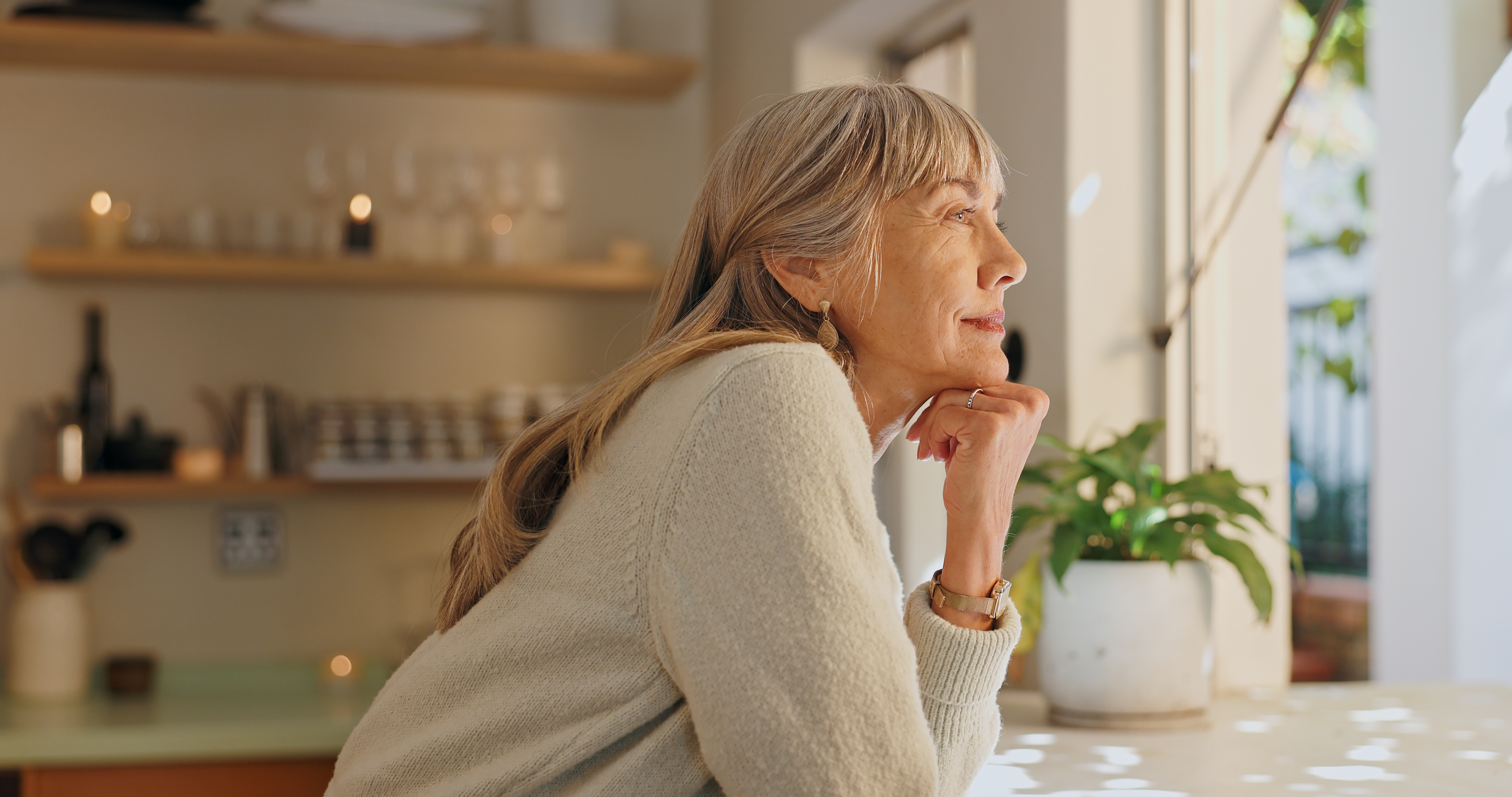 Window, smile and elderly woman with thinking at home for retirement